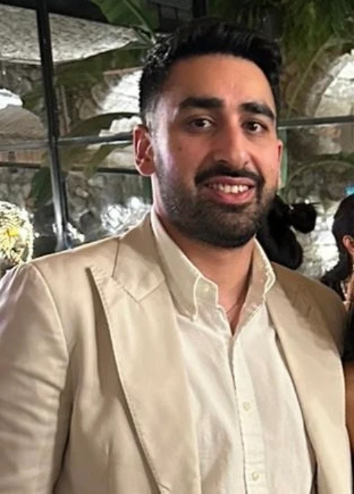 Mandeep Dev Portrait of Mandeep Dev in a beige jacket