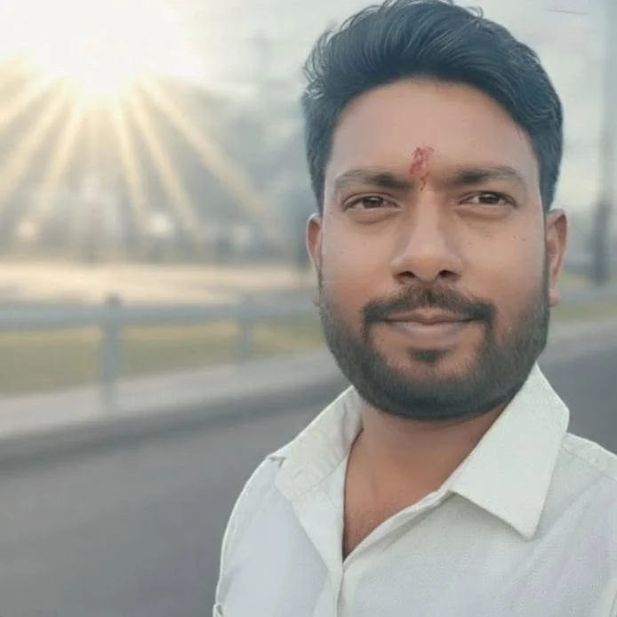 Mukesh Sah Portrait of Mukesh Sah smiling in the sunshine