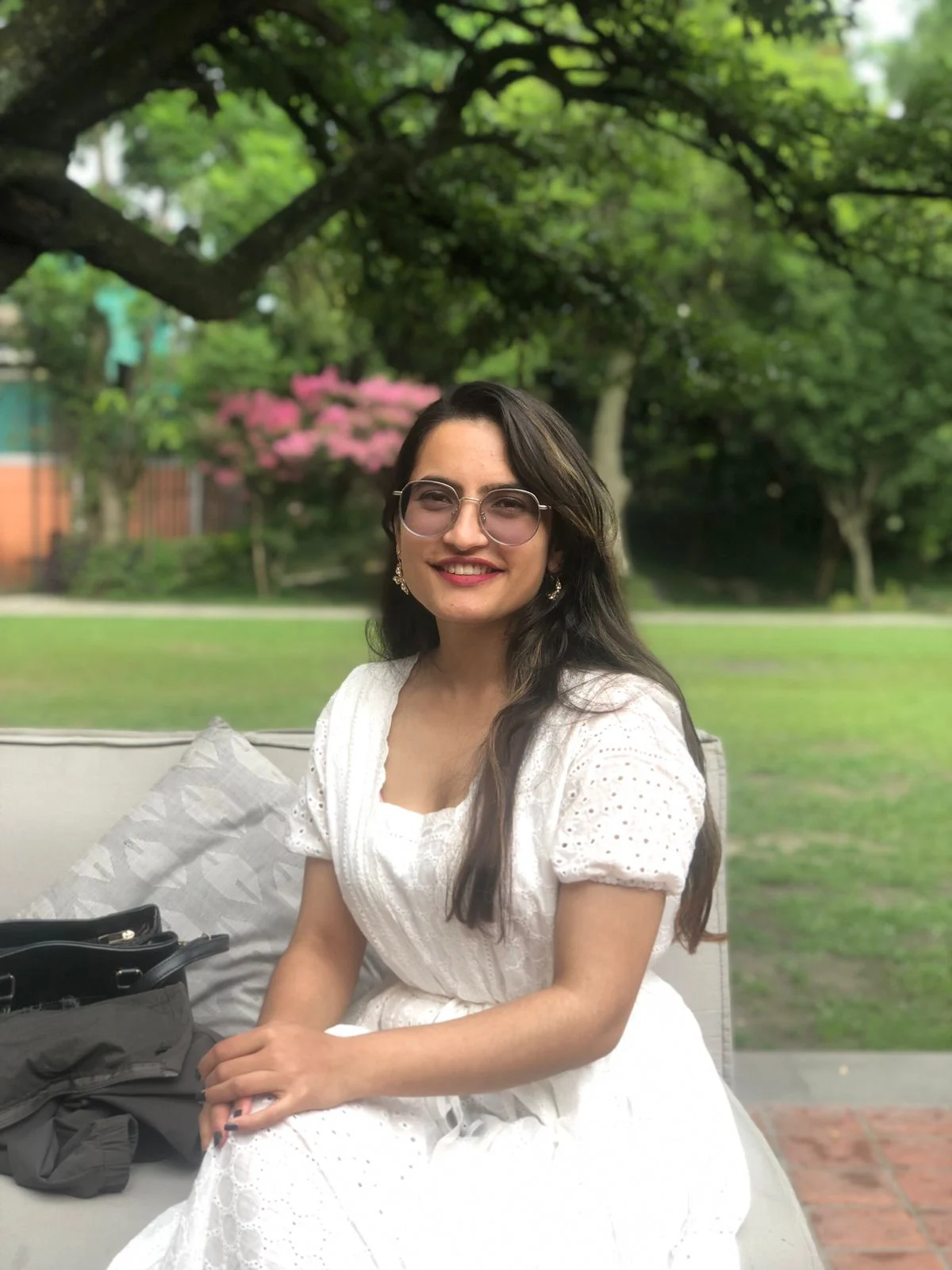 Prekshya Bhattarai Portrait of Prekshya Bhattarai in a white dress in a garden