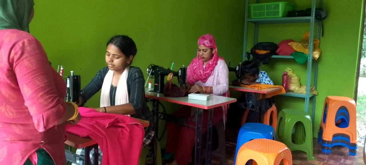 many girls face multiple barriers at once Women sitting at a table in a green room during a meeting